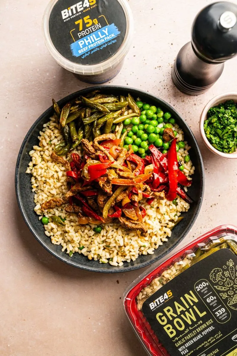 A finished bowl with buffalo chicken protein pack and grains